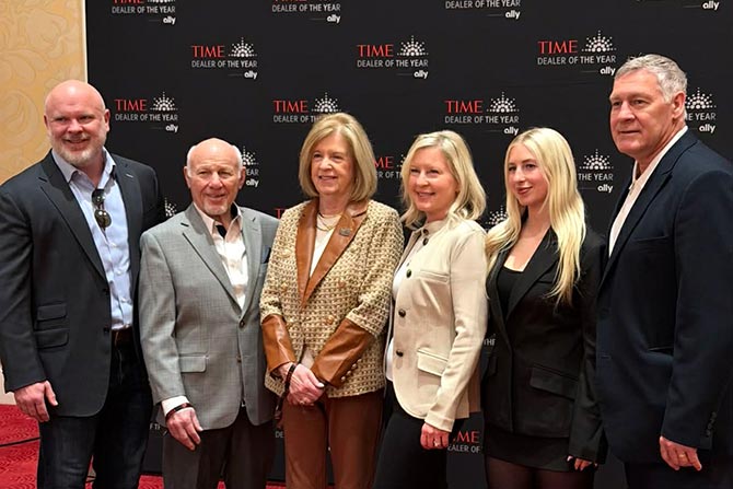 Congratulations-to-Ginger. Group of people posing with Ginger during her public recognition.